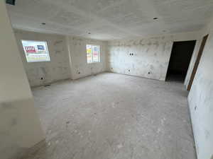Empty room featuring a textured ceiling