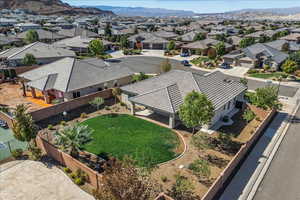 Aerial perspective of suburban area with a mountainous background