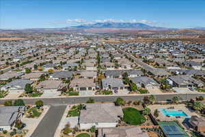 Aerial overview of property's location featuring a mountain backdrop