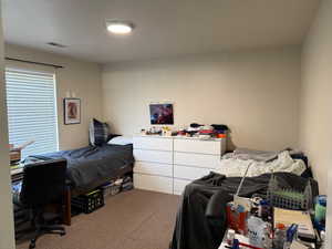 View of carpeted bedroom