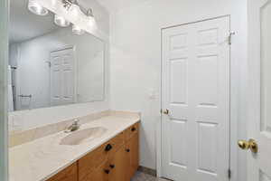 Bathroom with vanity and light tile patterned flooring