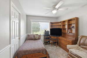 Bedroom featuring carpet flooring and ceiling fan