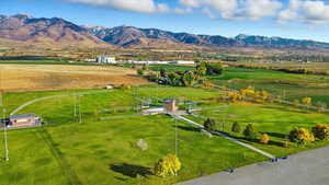 Aerial view of sparsely populated area featuring mountains and a pastoral area