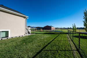 View of yard with a trampoline