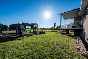 Fenced backyard with a playground