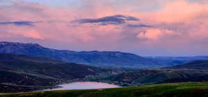 View of mountain backdrop with a nearby body of water