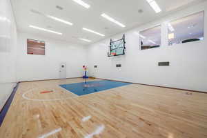 View of basketball court featuring basketball hoop