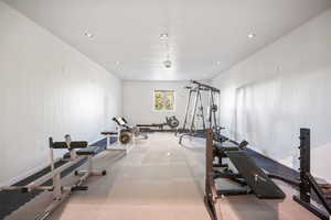 Exercise room featuring recessed lighting