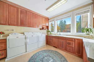 Laundry area with cabinet space and washer and dryer