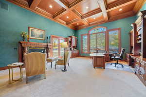 Office space with coffered ceiling, a wood ceiling with exposed beams, light colored carpet, recessed lighting, and crown molding