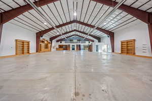 Garage featuring baseboards