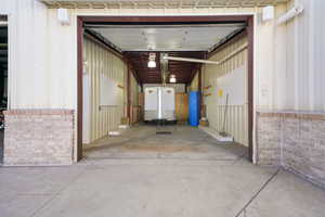 Garage featuring metal wall