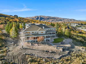 View from above of property with a mountain backdrop