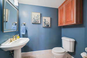 Bathroom featuring baseboards and tile patterned floors
