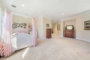 Bedroom featuring light carpet, recessed lighting, and crown molding