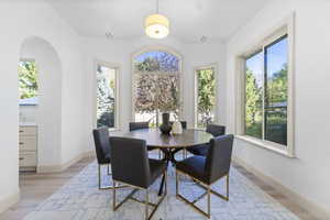 Dining room with plenty of natural light and light wood finished floors