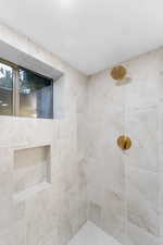Bathroom with a tile shower