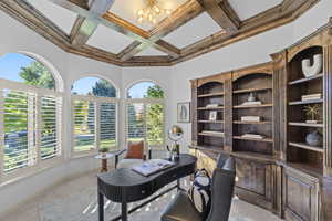 Office space with coffered ceiling, carpet, beamed ceiling, healthy amount of natural light, and a chandelier
