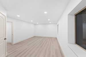Unfurnished room featuring light wood-style flooring and recessed lighting