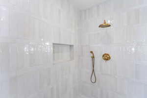 Bathroom view of a tile shower