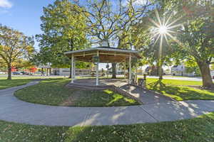 View of community with a yard, a patio area, and a gazebo