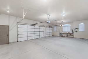 Garage featuring a garage door opener