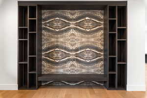 Detailed view of wood finished floors and baseboards