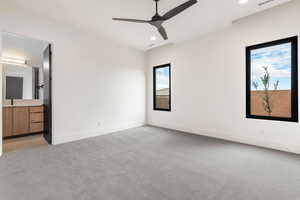 Unfurnished bedroom with light colored carpet, ceiling fan, and recessed lighting