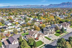 Aerial perspective of suburban area with a mountain backdrop