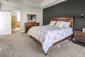 Bedroom features ensuite bathroom, and arched walkways.