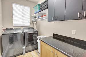 Laundry area with cabinet space and washing machine and dryer