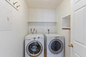 Enjoy the convenience of a main-level laundry room, thoughtfully located for easy access and everyday practicality. Designed to simplify your daily routine, it’s a functional and efficient addition to the home's layout.