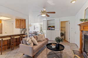 Warm and inviting, the main-floor family room features a cozy fireplace and flows effortlessly into the semi-formal dining area and kitchen—creating a functional and connected living space. Perfect for everyday living and entertaining, this open-concept