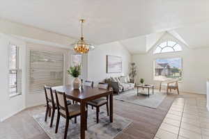 Spacious and bright formal dining room conveniently located just off the formal living area, creating a seamless flow between the two elegant spaces. Large windows fill the dining room with natural light, making it the perfect setting for memorable meals