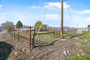 View of yard featuring a rural view and a mountain view