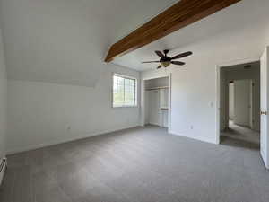 Unfurnished bedroom with light carpet, a closet, and a ceiling fan