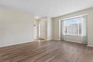 Empty room featuring light wood-style flooring and baseboards