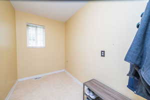 Directly across from the laundry room. Great for a mini office, hobby room, mud room, storage, etc