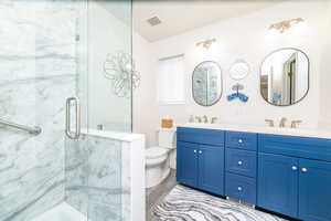 Bathroom with double vanity and solid surface newly updated shower