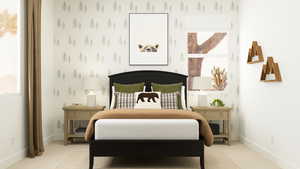 Bedroom featuring light colored carpet and baseboards