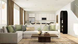 Living room featuring light wood-type flooring and stairs