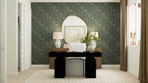 Carpeted office space featuring baseboards