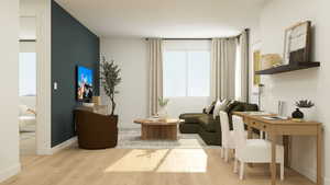 Living area with wood finished floors and an office area