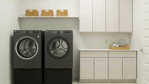 Laundry room with cabinet space and washing machine and dryer