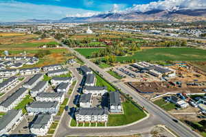 Aerial overview of property's location featuring a mountainous background