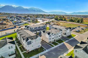 Aerial view of residential area featuring a mountain backdrop