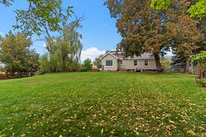 View of yard with a wooden deck