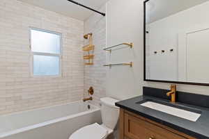 Bathroom with vanity and  shower combination