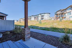 View of patio / terrace looking onto HOA green space.