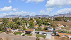 Aerial perspective of suburban area with a mountain backdrop